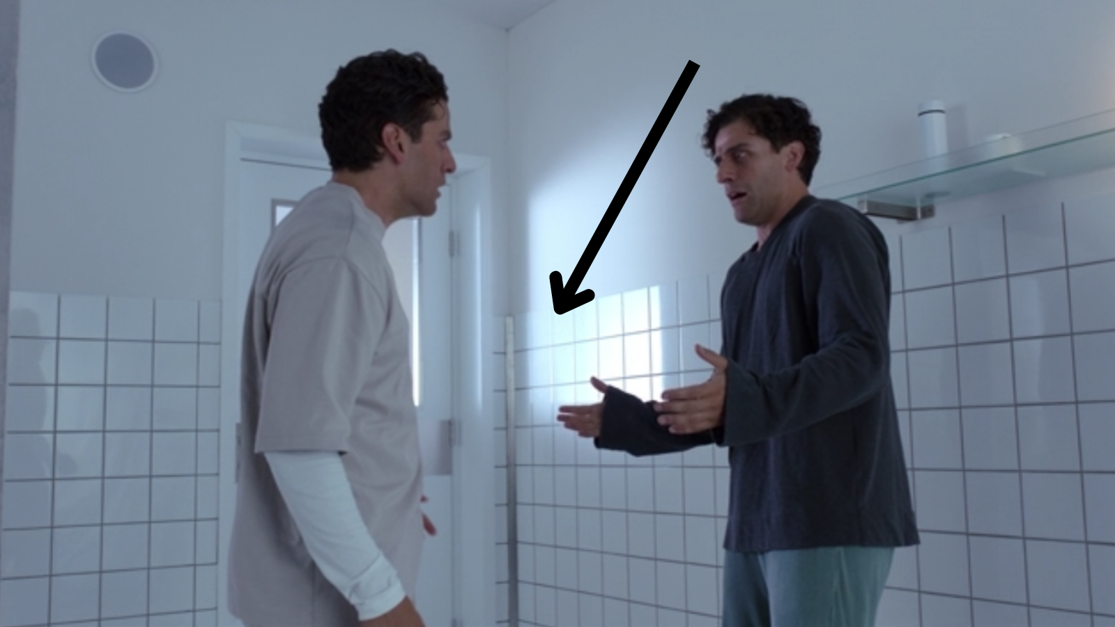 Marc and Steven in a hospital with an arrow pointing out the line that their hands don't cross
