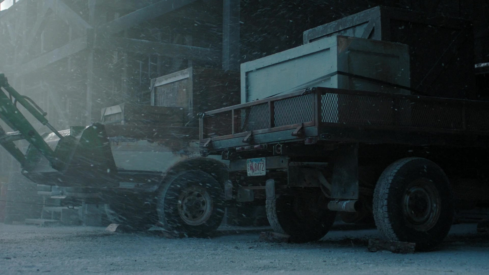 The backs of some kind of vehicles from the same episode as above. The front of the tractor can be seen but not the logo, nor did it move in the scene in question while these two vehicles did.